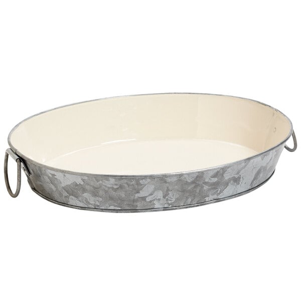 A GET oval galvanized metal tray with handles.