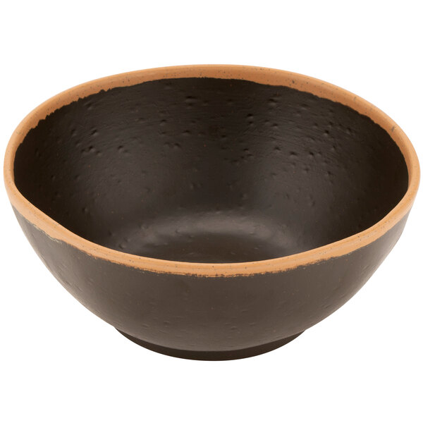 A black bowl with a brown rim.