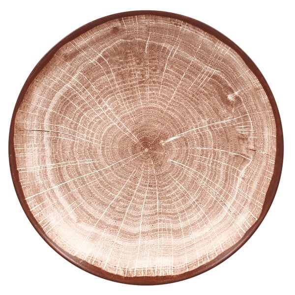 A RAK Porcelain walnut brown porcelain coupe plate with a tree stump pattern.