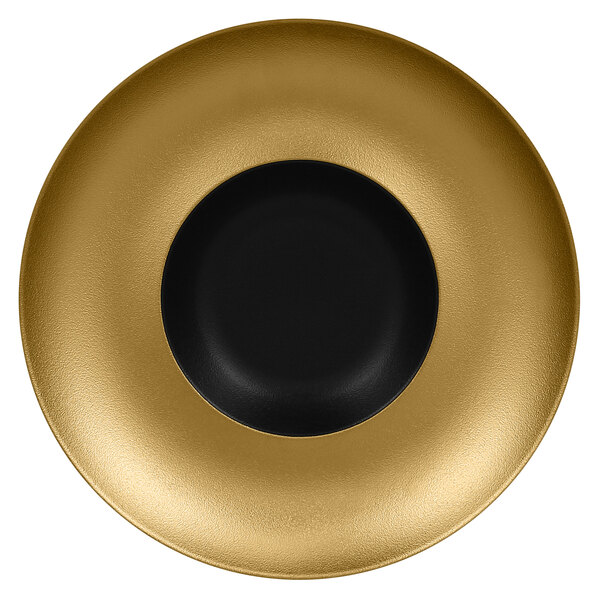 A gold porcelain plate with a black center and rim.