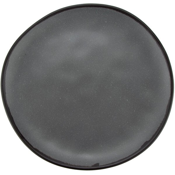 A grey melamine dinner plate with speckled edges.