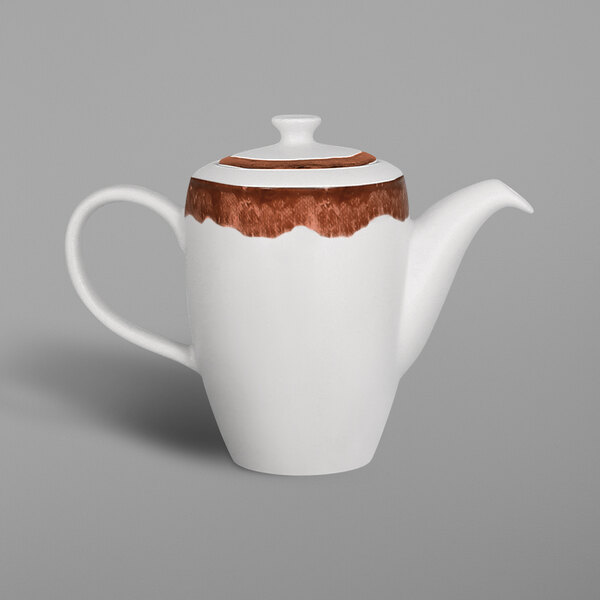 A white porcelain coffee pot with brown paint and a walnut brown lid and handle.