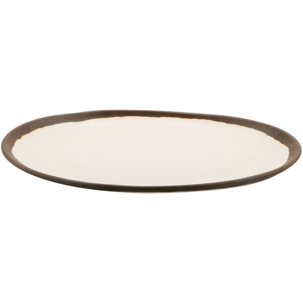 A GET glazed cream melamine plate with a brown rim.