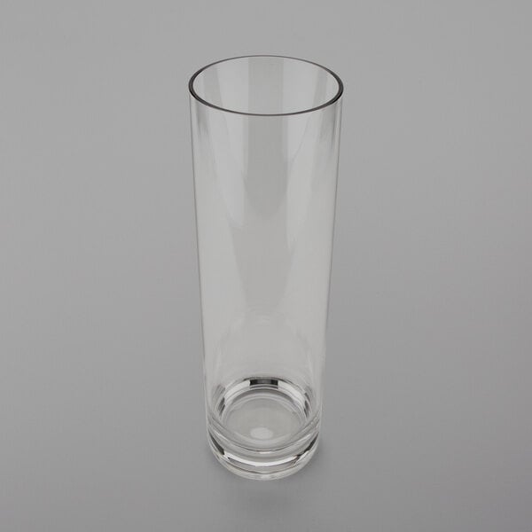 A clear polycarbonate accent vase on a white surface.