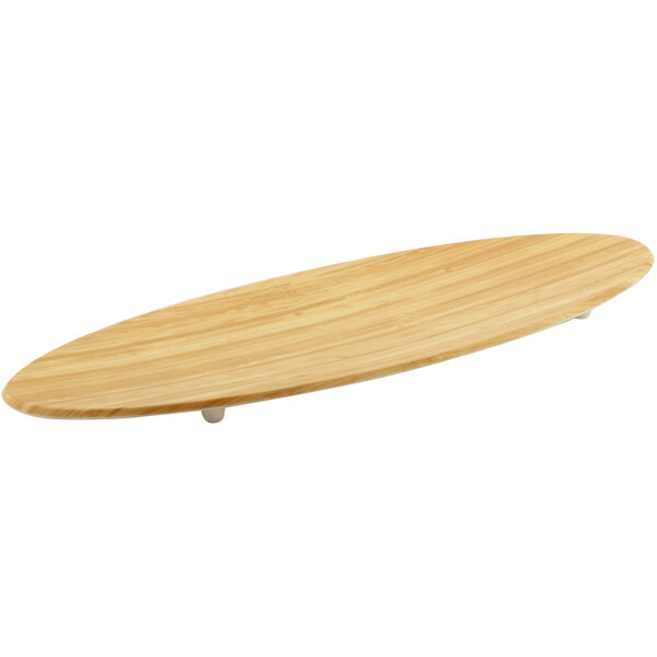 A faux bamboo surf board serving platter with a white background.