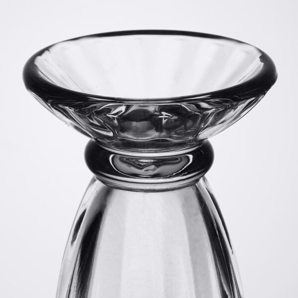 A clear Libbey tulip sundae glass with a small bowl on top.