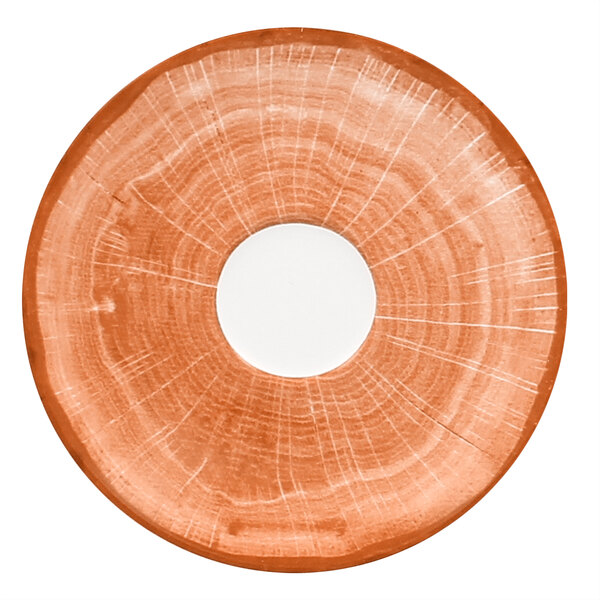 A white porcelain saucer with a circular hole and a white rim.