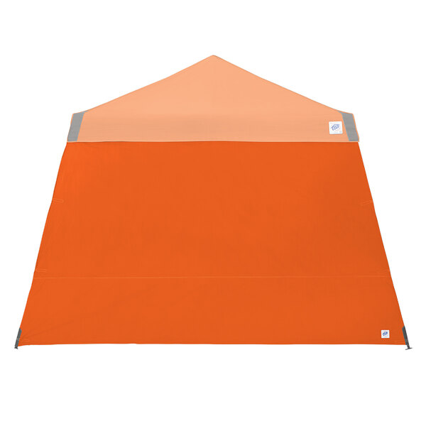 An orange E-Z Up canopy sidewall with grey stripes.