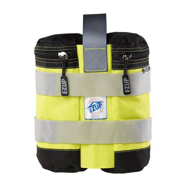 A yellow and black E-Z Up weight bag with a zipper.