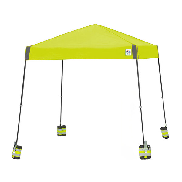 A yellow E-Z Up canopy tent with weight bags on the legs.