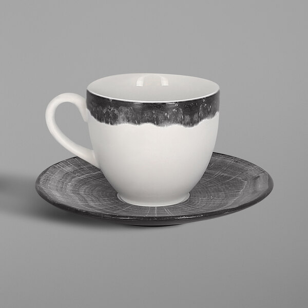 A RAK Porcelain beech grey coffee cup and saucer with white and black accents.
