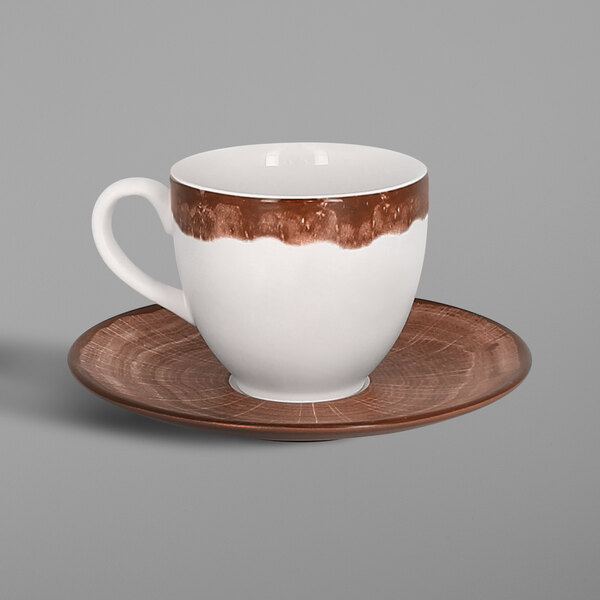 A RAK Porcelain white and brown porcelain coffee cup and saucer on a table.