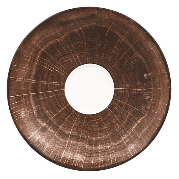 A circular brown porcelain saucer with a white circle in the middle.