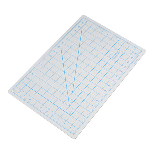 A white translucent self-healing cutting mat with blue grid lines and measurements, sized 12 by 18 inches.