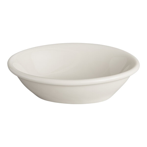 An eggshell-colored oval china fruit or monkey dish.