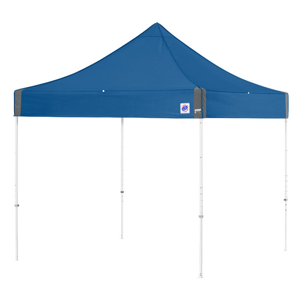 A blue E-Z Up canopy with white poles and a white triangle top.
