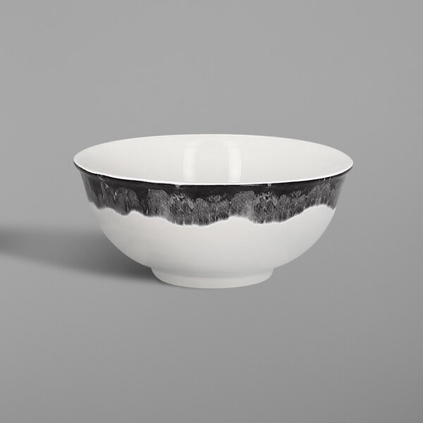 A white porcelain bowl with a black beech wood border.