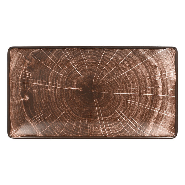 A RAK Porcelain rectangular oak brown serving platter with a wood pattern on it.