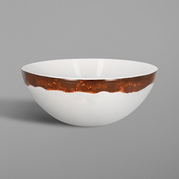 a white bowl on a wooden surface