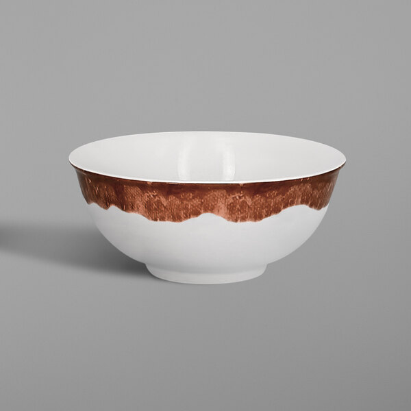 A white bowl with a brown rim.