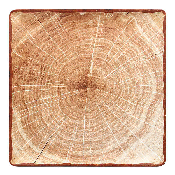 A square RAK Porcelain plate with a circular wood pattern in brown.