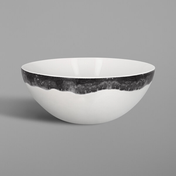a white bowl with black trim