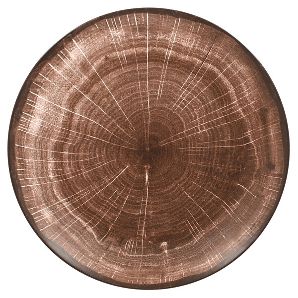 A RAK Porcelain Woodart oak brown porcelain plate with a wood pattern.