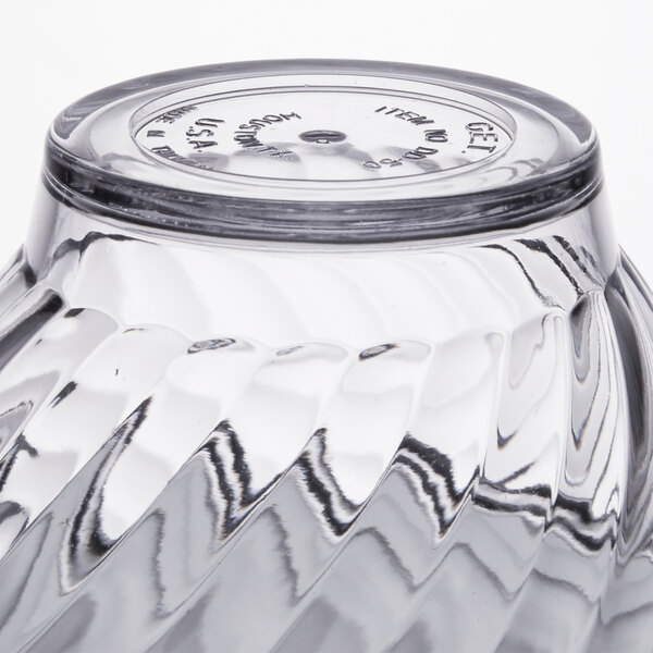 A close up of a clear tulip dessert dish.