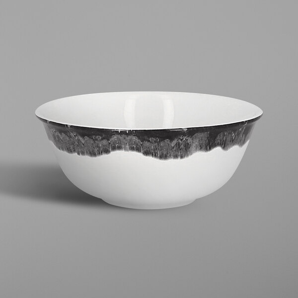 a white bowl with black rim