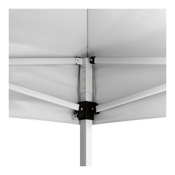 A close-up view of the interior frame and canopy fabric of a white pop-up tent.