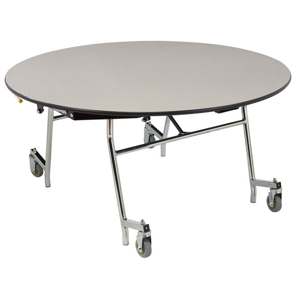 A white round National Public Seating cafeteria table with a black T-mold edge and wheels.