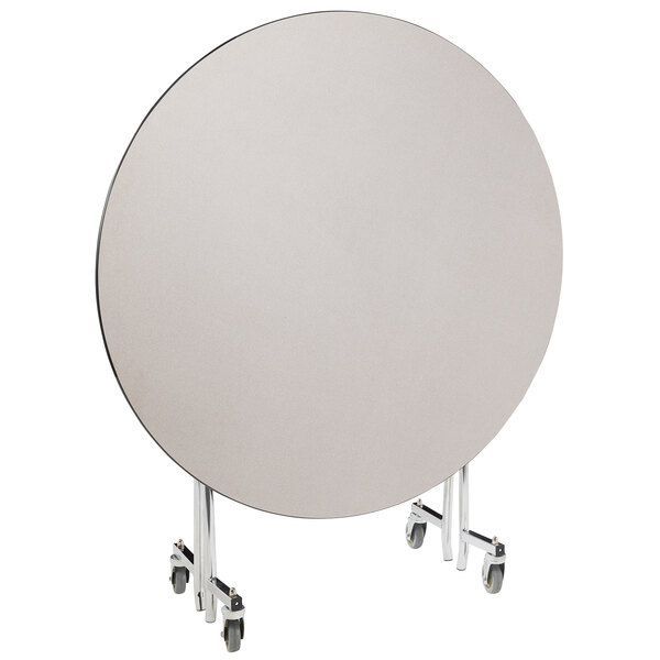 A round white National Public Seating cafeteria table with wheels.