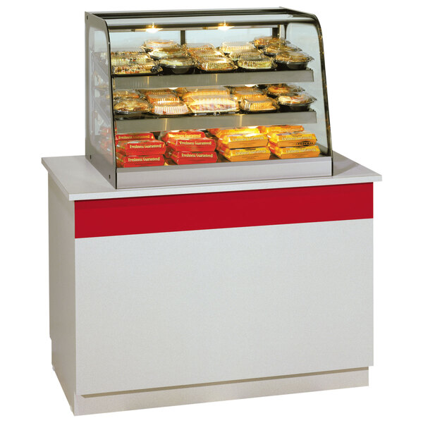 A Federal Industries countertop heated display case full of food.