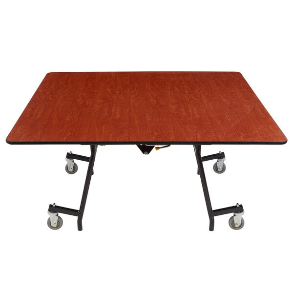 A National Public Seating square cafeteria table with a wood surface and black T-mold edge.