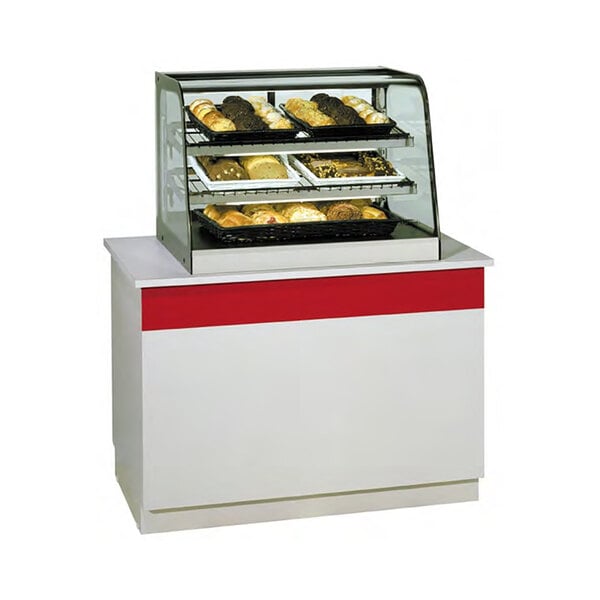 A Federal Industries black countertop bakery display case with food displayed inside.