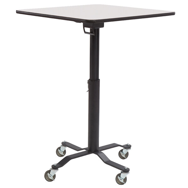 A National Public Seating Cafe Time II table with a whiteboard top and T-molding edge on wheels.