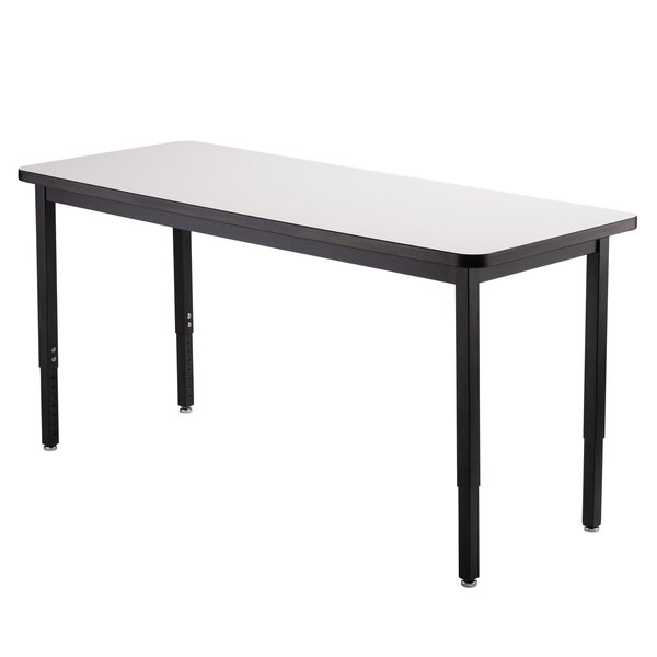 A white rectangular table with black legs.