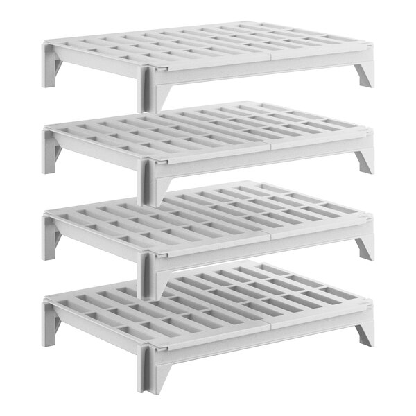A set of four white vented plastic shelving units designed for stationary storage.