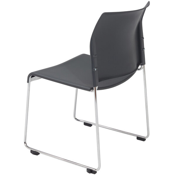 A National Public Seating black plastic chair with chrome legs.