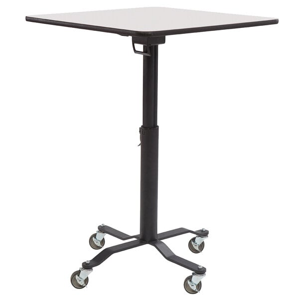 A National Public Seating Cafe Time II square table with a whiteboard top and wheels on it.