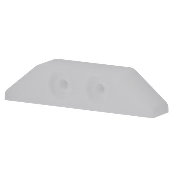 a white plastic object with holes