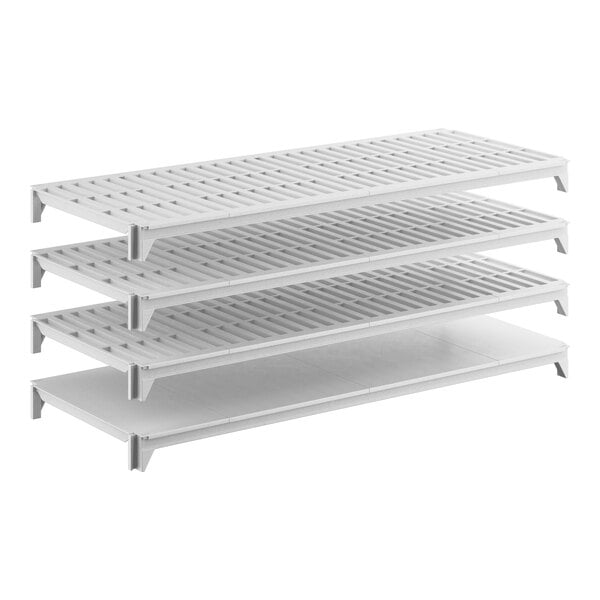 A white stationary shelving kit with three vented shelves and one solid shelf.