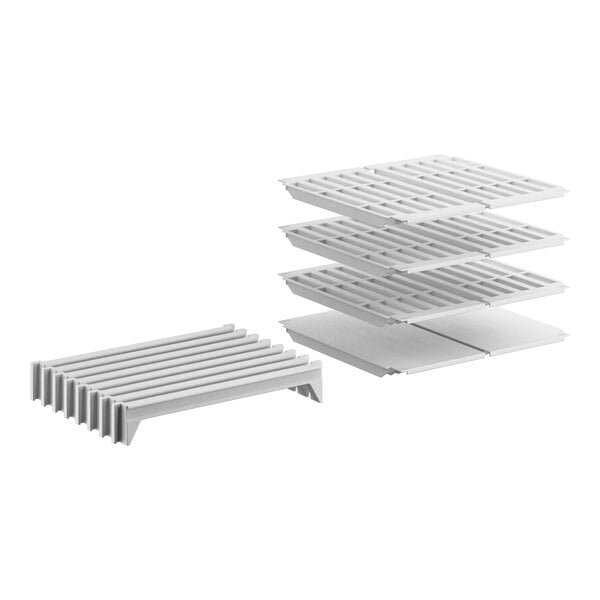 A white Cambro Camshelving stationary shelf kit with 3 vented shelves and 1 solid shelf.