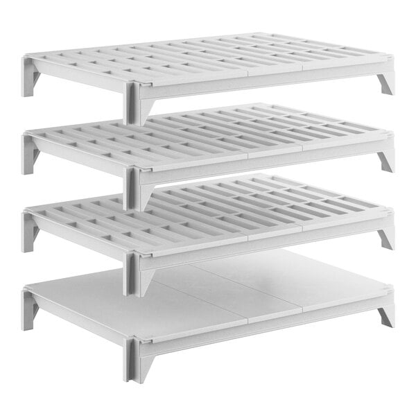 A set of four white shelving units, including three vented shelves and one solid shelf, designed for stationary storage.
