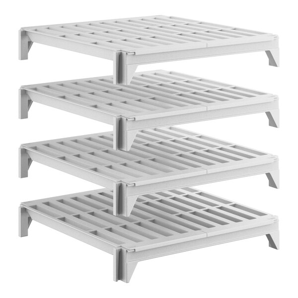 A set of four square, vented plastic shelving units designed for stationary storage.