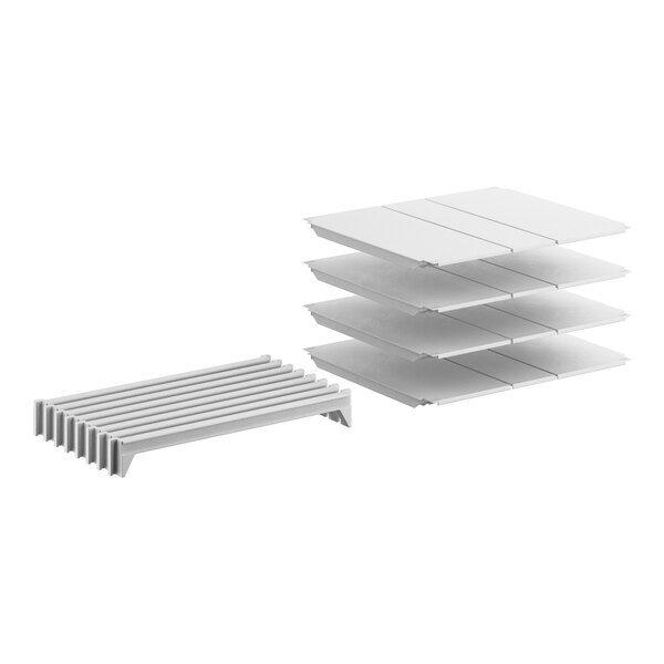 A white Camshelving Premium stationary shelf kit with 4 shelves.