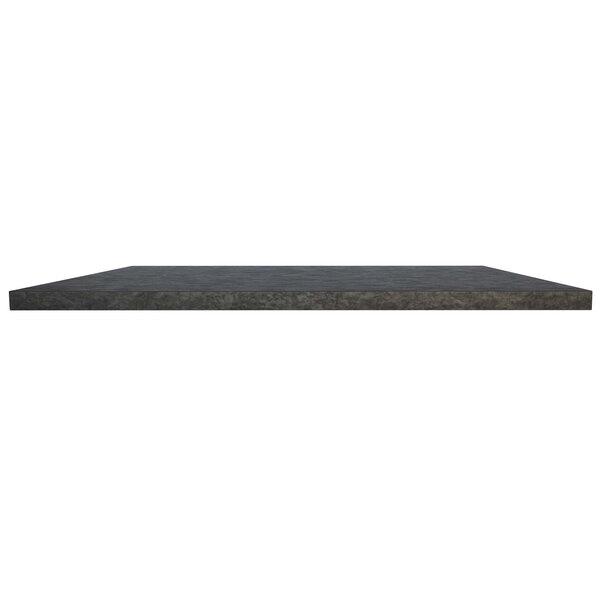 A dark concrete rectangular table top on a table.