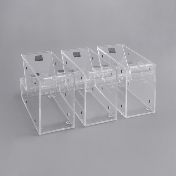 A row of clear plastic Choice candy dispensers with scoop holsters.