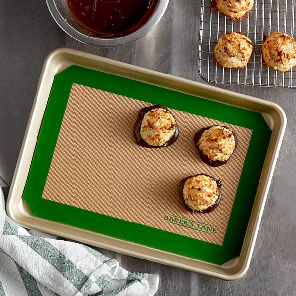 A Baker's Lane baking mat on a tray of cookies.