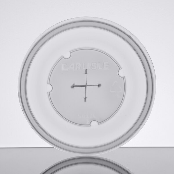 A white plastic lid with a cross on it.